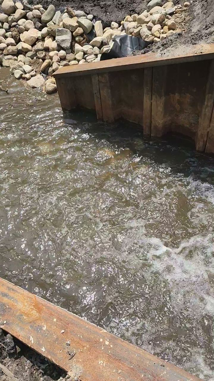 New steel sheet-pile spillway on a rebuilt Michigan lake dam