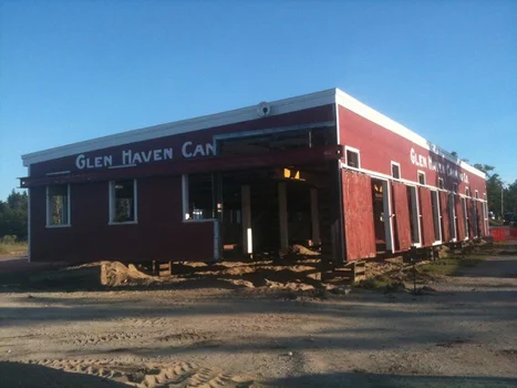 House raised on cribbing and moved by Contractors Marine heavy hauling crew